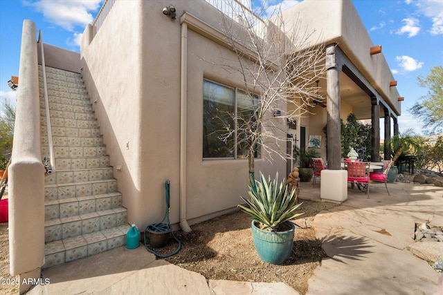 view of side of home featuring a patio