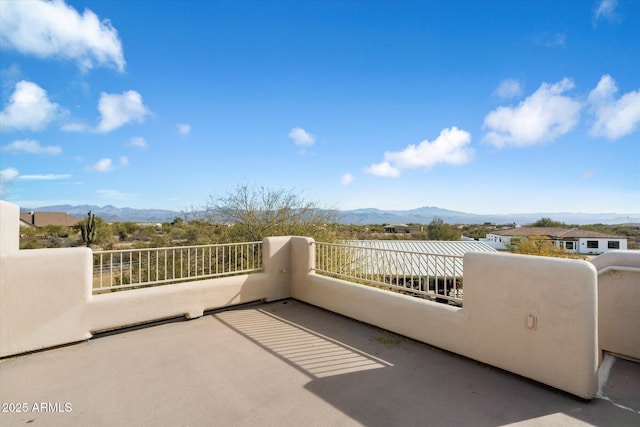 balcony featuring a mountain view