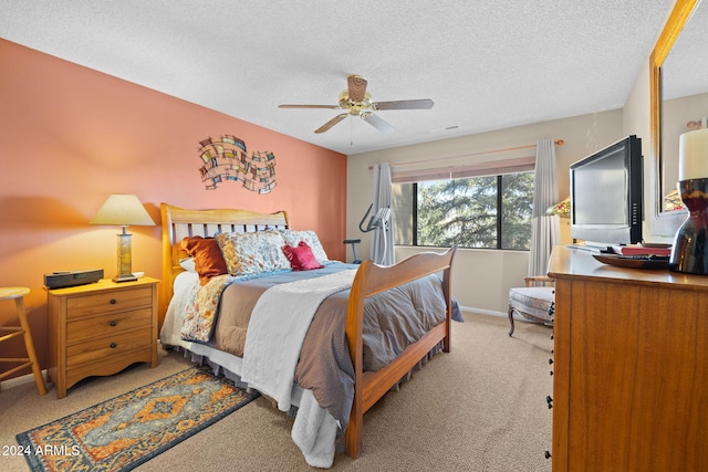 carpeted bedroom featuring a textured ceiling