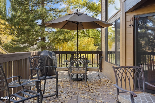 wooden terrace featuring grilling area