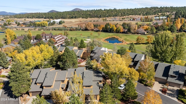 drone / aerial view featuring a water and mountain view