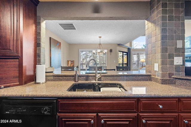 kitchen featuring black dishwasher, sink, a notable chandelier, light stone countertops, and a textured ceiling