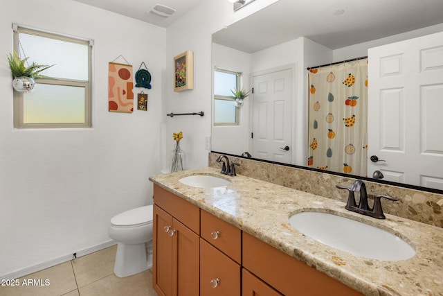 bathroom with tile patterned flooring, visible vents, toilet, and a sink