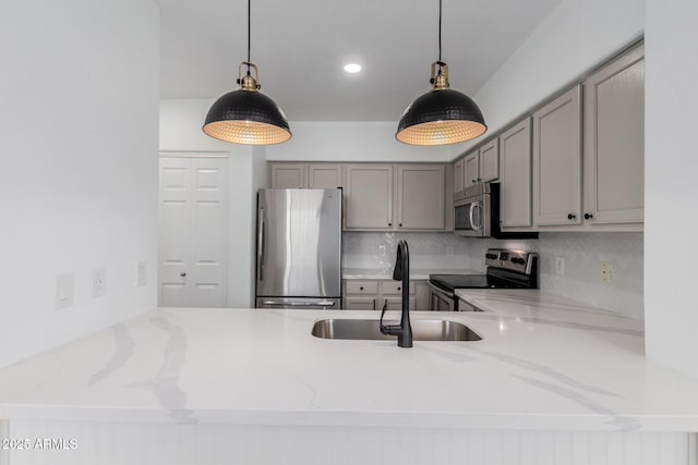 20100 N 78th Pl Unit 2114, Scottsdale, AZ 85255 - kitchen featuring stainless steel appliances, gray cabinets, decorative backsplash, a peninsula, and recessed lighting