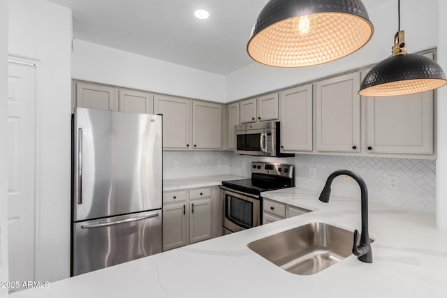 20100 N 78th Pl Unit 2114, Scottsdale, AZ 85255 - kitchen with appliances with stainless steel finishes, gray cabinetry, tasteful backsplash, and recessed lighting