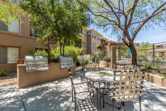 20100 N 78th Pl Unit 2114, Scottsdale, AZ 85255 - view of patio / terrace featuring exterior kitchen and outdoor dining space