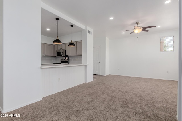 20100 N 78th Pl Unit 2114, Scottsdale, AZ 85255 - unfurnished living room featuring a ceiling fan, recessed lighting, and light carpet