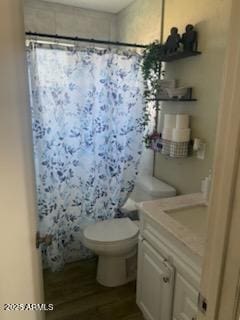 3431 W Campbell Ave, Phoenix, AZ 85017 - full bathroom with vanity, a shower with shower curtain, wood finished floors, and toilet