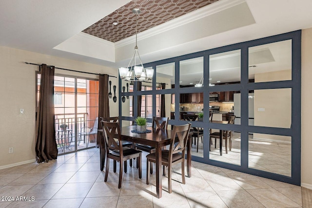 dining space featuring french doors, a raised ceiling, a notable chandelier, crown molding, and light tile patterned floors