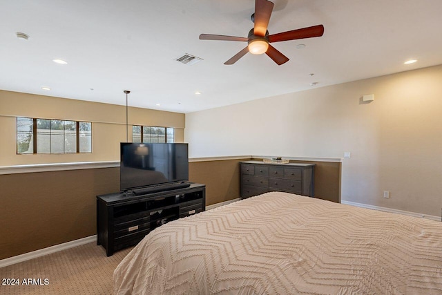 bedroom with ceiling fan and light colored carpet