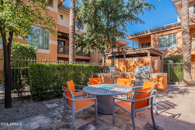 view of patio featuring an outdoor kitchen and grilling area