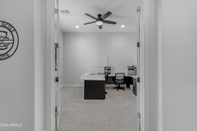 home office featuring light colored carpet and ceiling fan