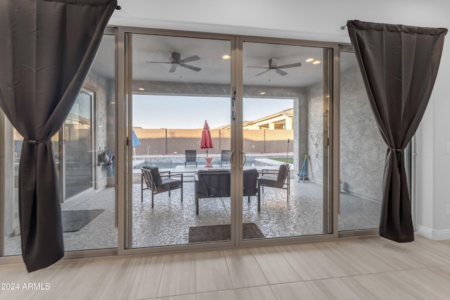 entryway featuring ceiling fan and a healthy amount of sunlight