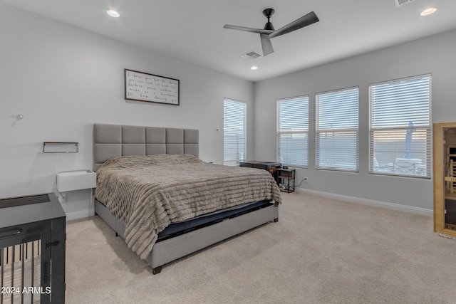 bedroom featuring ceiling fan and light colored carpet