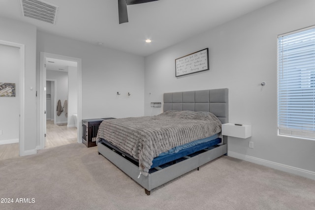 bedroom featuring ceiling fan and light carpet