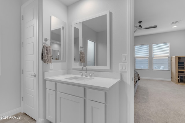 bathroom featuring ceiling fan and vanity