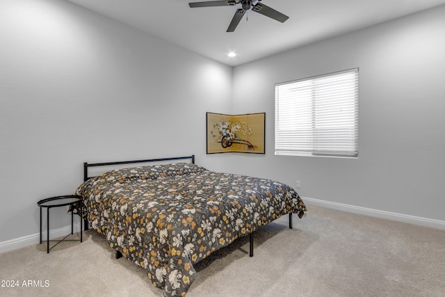 bedroom with light carpet and ceiling fan