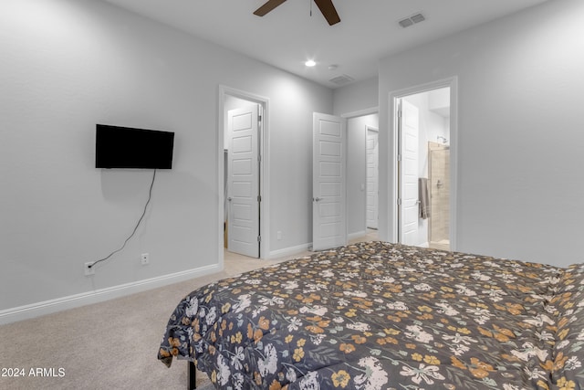 carpeted bedroom with connected bathroom and ceiling fan