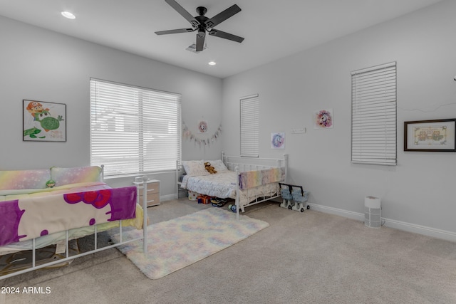 bedroom with light carpet and ceiling fan