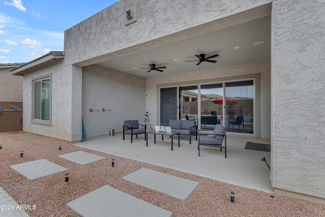 view of patio featuring an outdoor living space and ceiling fan