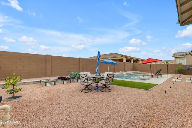 view of yard with a fenced in pool and a patio area