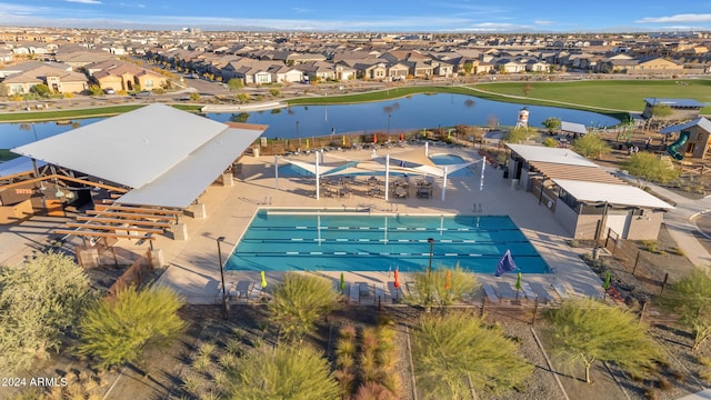 birds eye view of property with a water view