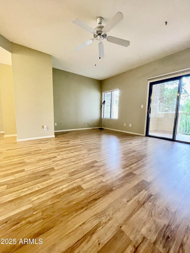 19400 N Westbrook Pkwy Unit 216, Peoria, AZ 85382 - unfurnished room featuring baseboards, light wood-style floors, and a ceiling fan
