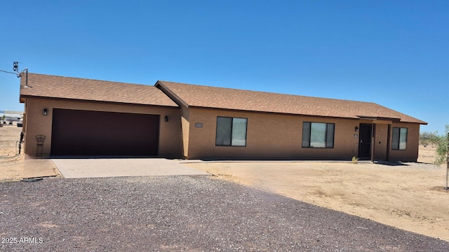 31515 W Buchanan St, Buckeye, AZ 85326 - ranch-style house featuring a garage, driveway, and stucco siding