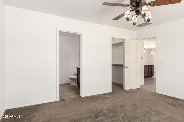 31515 W Buchanan St, Buckeye, AZ 85326 - unfurnished bedroom with carpet flooring, a spacious closet, connected bathroom, a closet, and ceiling fan