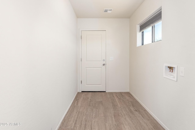 31515 W Buchanan St, Buckeye, AZ 85326 - hallway featuring light wood finished floors and baseboards