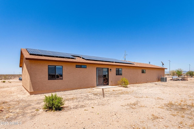 31515 W Buchanan St, Buckeye, AZ 85326 - rear view of property with roof mounted solar panels and stucco siding