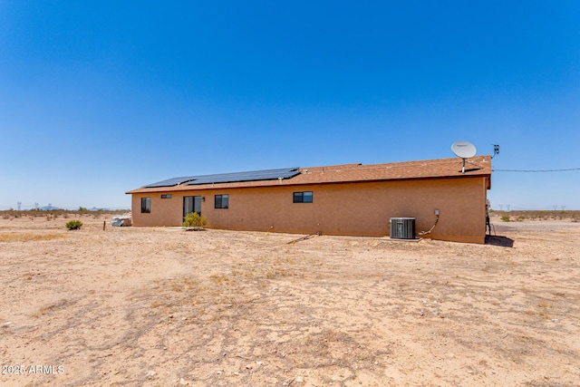 31515 W Buchanan St, Buckeye, AZ 85326 - back of house featuring roof mounted solar panels and stucco siding