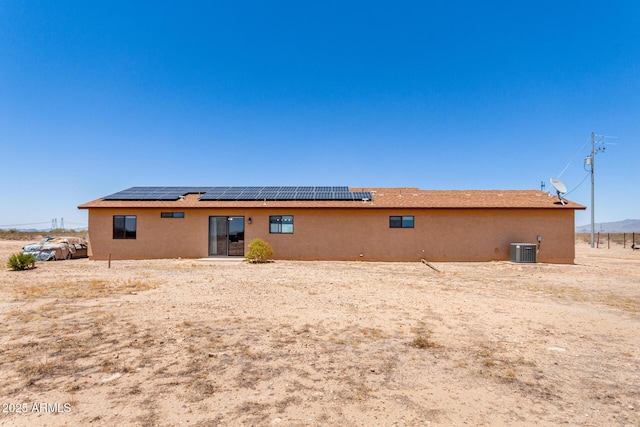 31515 W Buchanan St, Buckeye, AZ 85326 - back of property with roof mounted solar panels and stucco siding