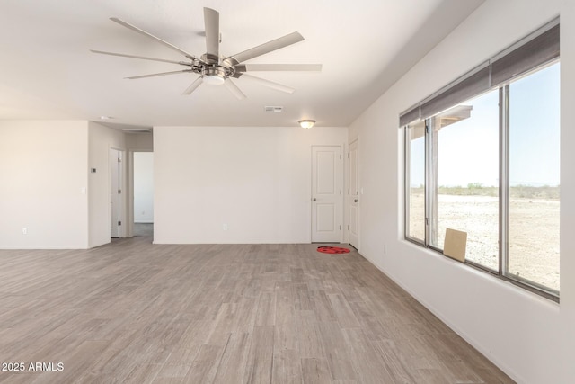 31515 W Buchanan St, Buckeye, AZ 85326 - spare room with ceiling fan and light wood-style flooring