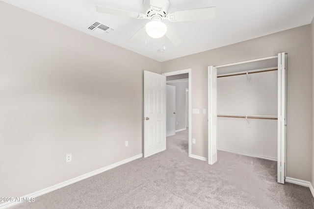 unfurnished bedroom featuring a closet, visible vents, carpet flooring, and baseboards