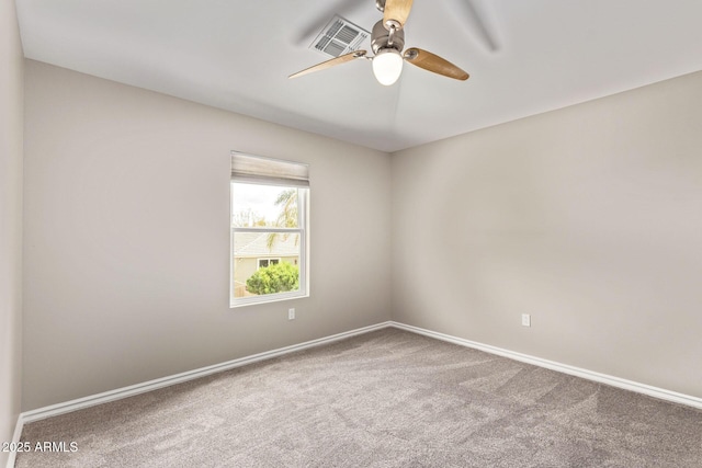 empty room featuring visible vents, baseboards, ceiling fan, and carpet floors