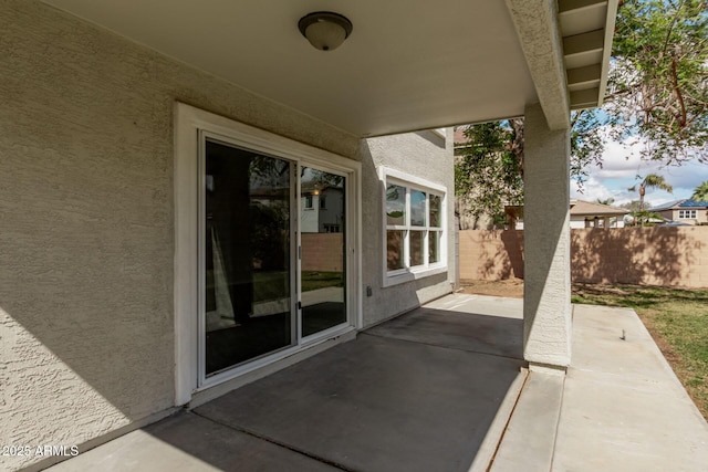 view of patio featuring fence