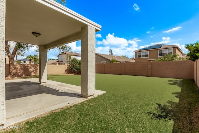 view of yard featuring a patio area and a fenced backyard