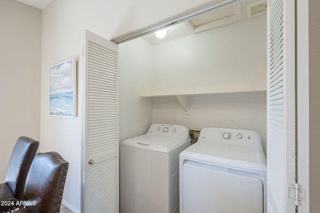 washroom with washer and clothes dryer