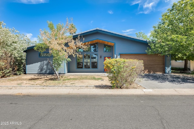view of front of house with an attached garage and driveway