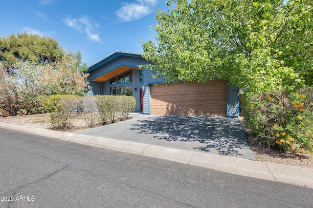 view of front of house with a garage and driveway