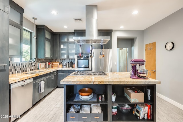 kitchen with visible vents, island range hood, appliances with stainless steel finishes, open shelves, and a sink