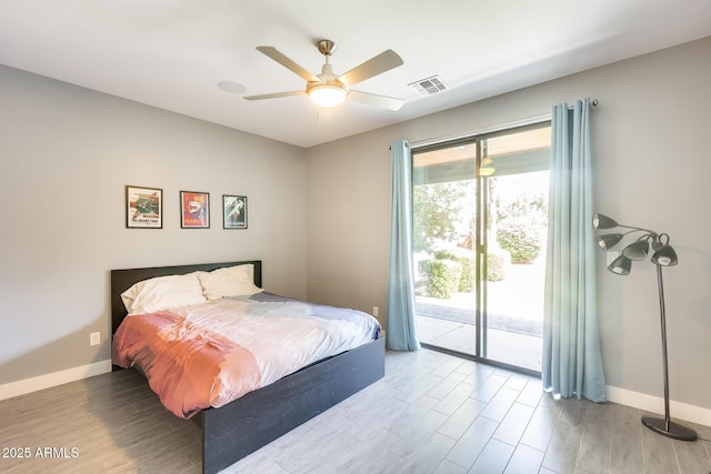 bedroom with a ceiling fan, visible vents, wood finished floors, baseboards, and access to outside