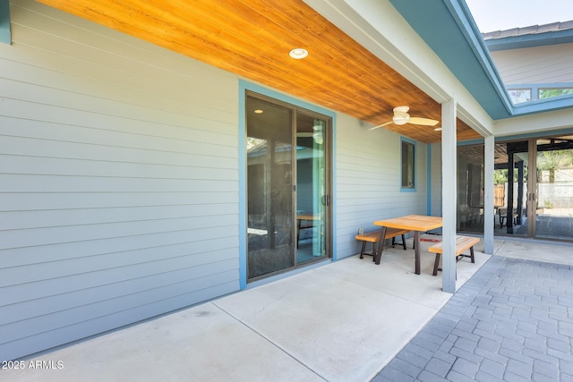 view of patio / terrace with ceiling fan and outdoor dining space