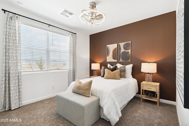 bedroom featuring carpet, visible vents, and baseboards