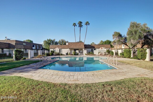 community pool with a patio area