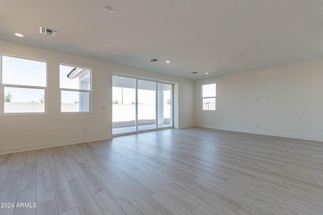 spare room with light wood-type flooring