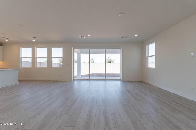 interior space with a healthy amount of sunlight and light hardwood / wood-style flooring