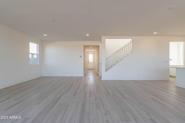 unfurnished living room with light hardwood / wood-style floors