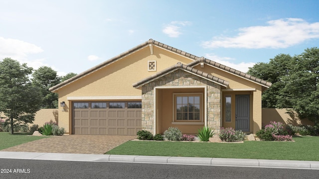 view of front of property with a garage and a front lawn